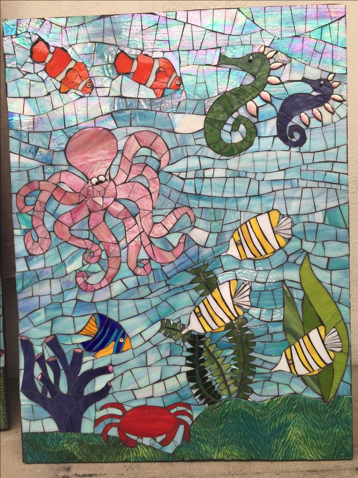 an octopus, seahorse and other marine animals are depicted in this stained glass mosaic