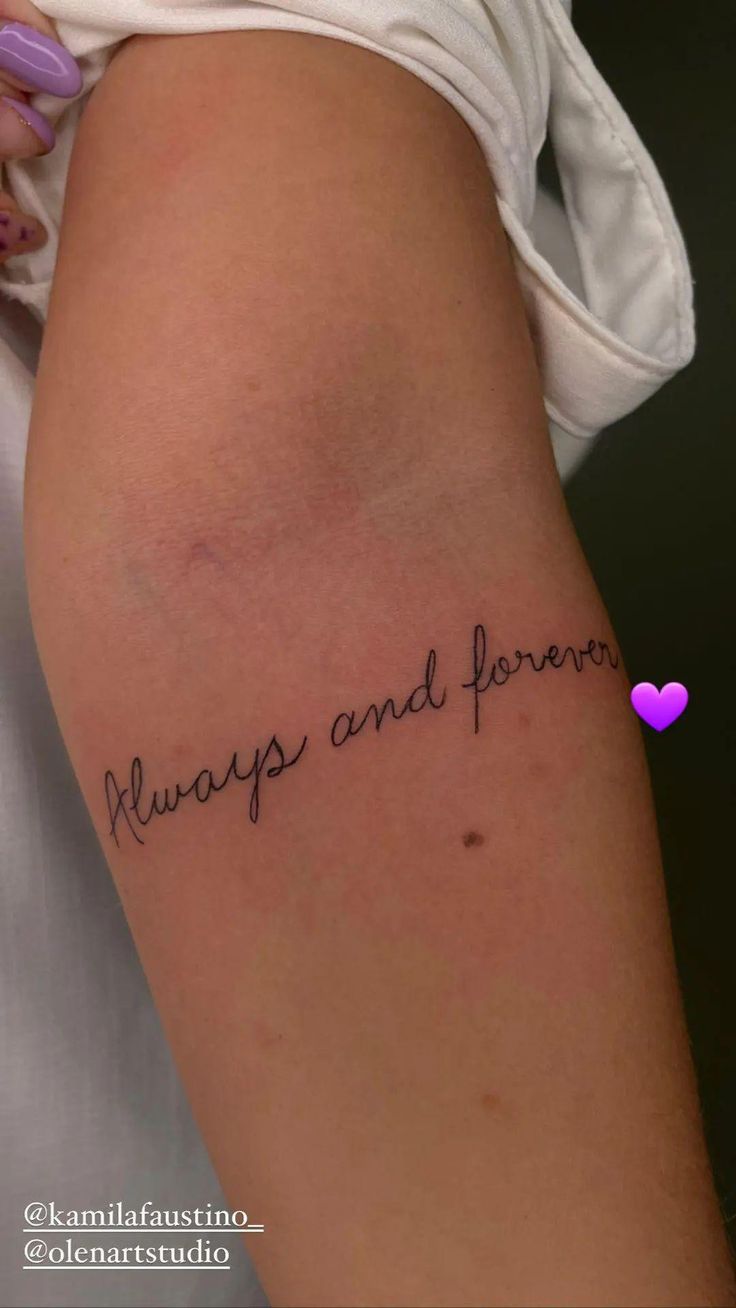 a woman's arm with the words always and forever tattooed on her left side