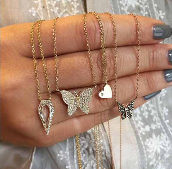 Woman's hand displaying diamond butterfly necklace with other yellow gold & diamond necklaces Butterfly Chain Necklace, Diamond Butterfly Necklace, Triple Layer Necklace, Butterfly Chain, Jewelry Butterfly, Print Butterfly, Charm Choker Necklace, Diamond Butterfly, Bar Pendant Necklace