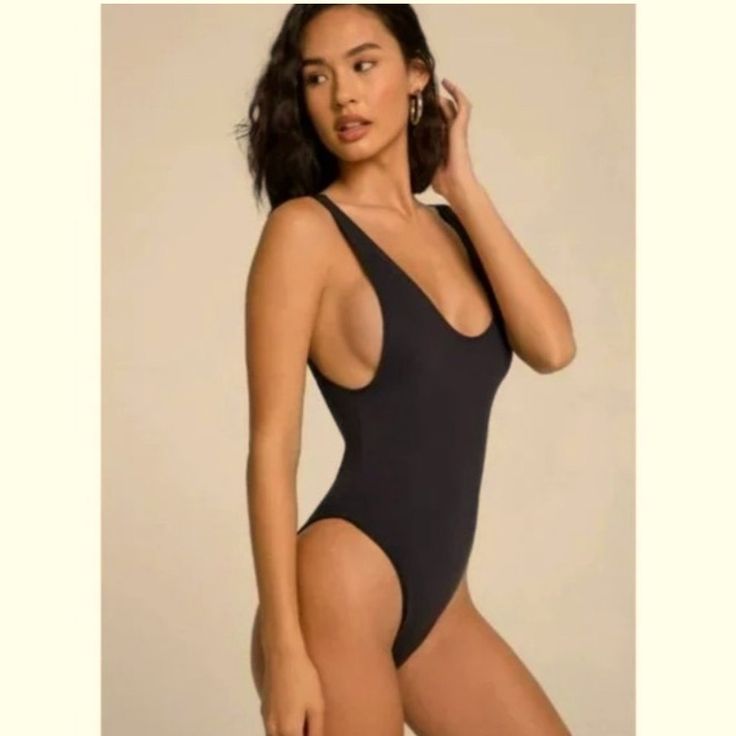 Sexy Black One Piece With Shelf Bra. Size Medium/ 8 New With Tags, From A Smoke And Pet Free Home. Similar Fit To A Gooseberry Swim Suit. Elegant Black Seamless Swimwear, Black Bodysuit With Built-in Bra For Club, Elegant Black Seamless Bodysuit, Trendy Solid Color Swimwear For Club, Basic Black Bodysuit For Summer, Basic Black Summer Bodysuit, Chic Solid Swimwear For Night Out, Sleek Black Sleeveless Swimwear, Black Seamless Backless Bodysuit