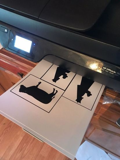 a printer that is sitting on top of a table with some paper in front of it