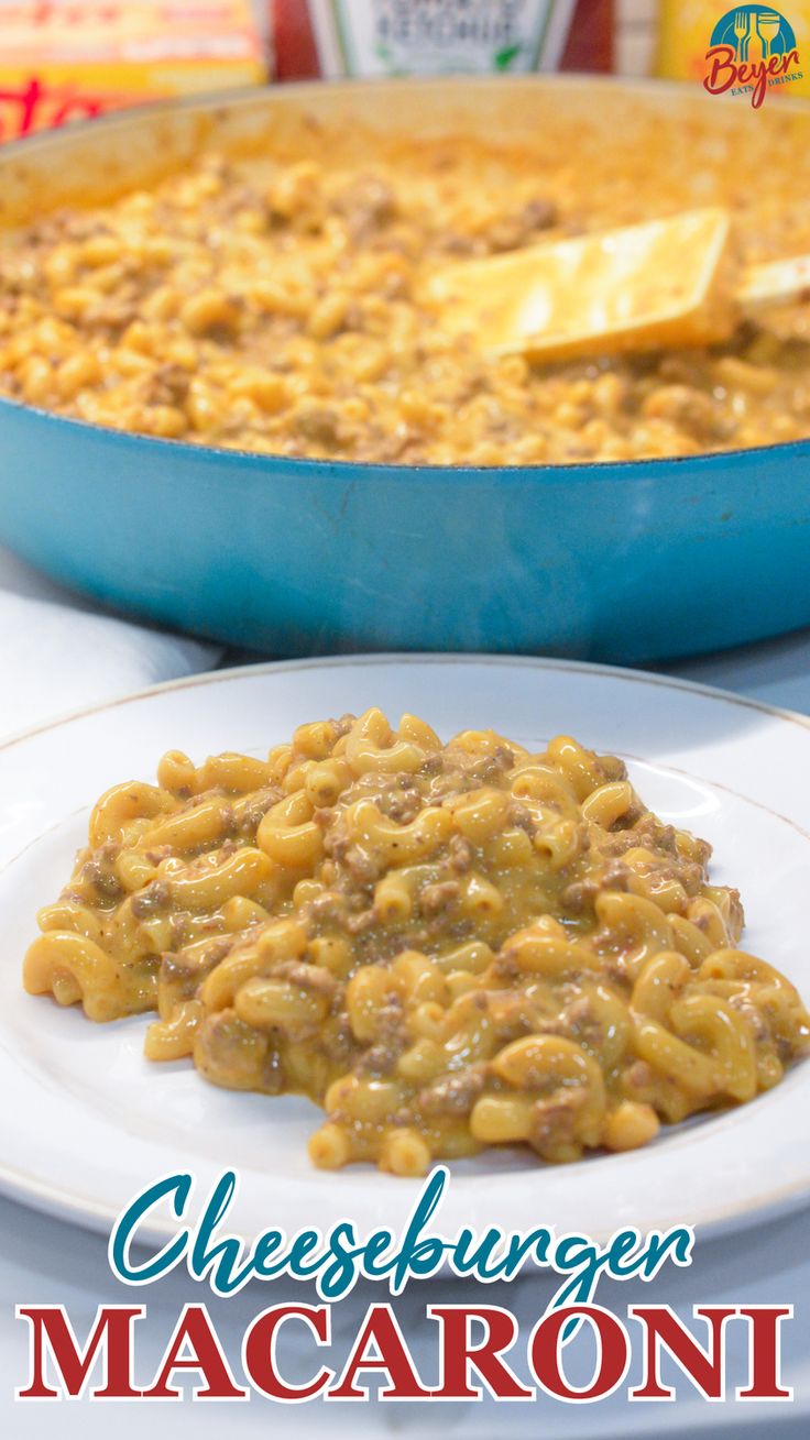 cheeseburger macaroni and cheese casserole on a white plate in front of a blue pan