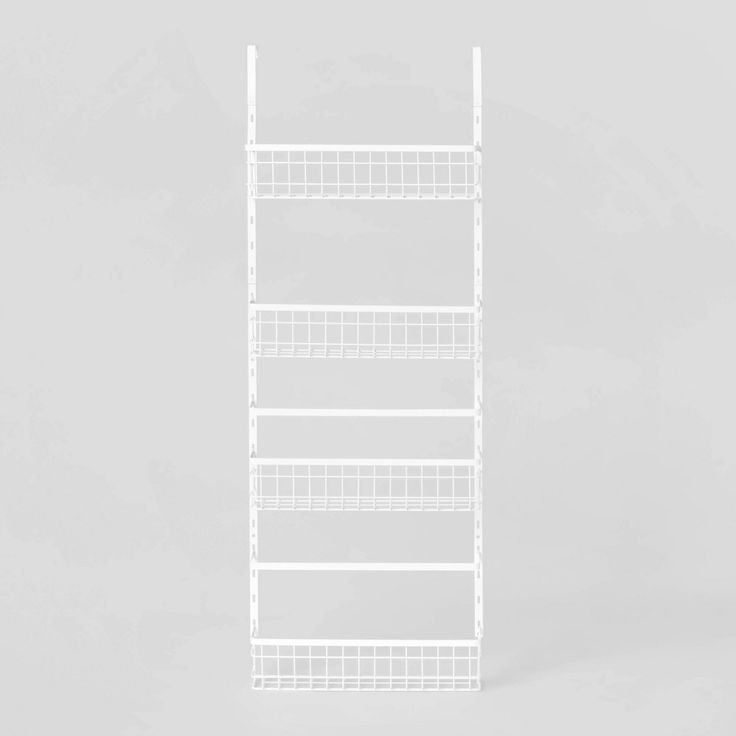 white wire shelving unit with four shelves on each side and one shelf above the other