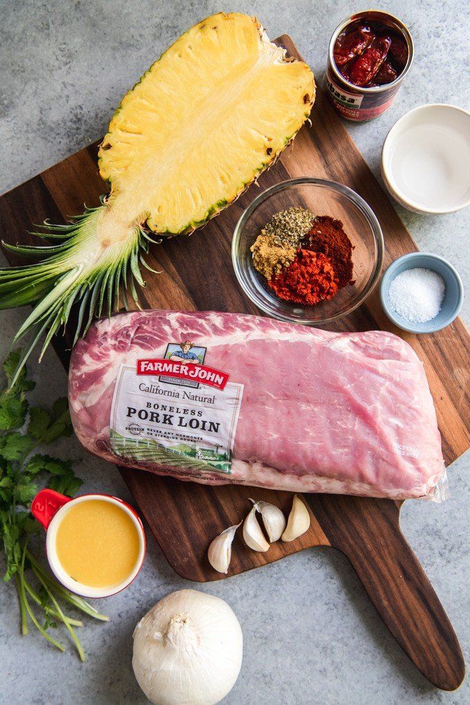 ingredients for pineapple pork loin laid out on a cutting board