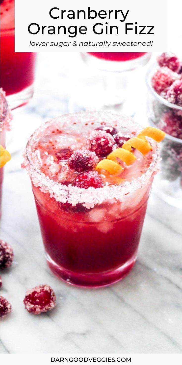 the cranberry orange fizz is garnished with powdered sugar and fruit