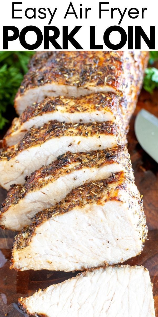 sliced pork on a cutting board with parsley