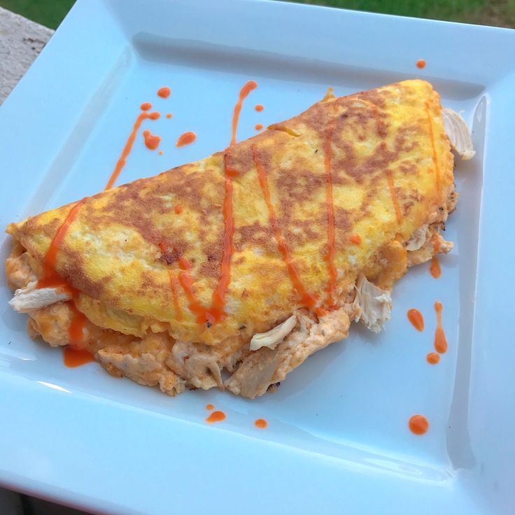 an omelet is sitting on a blue plate