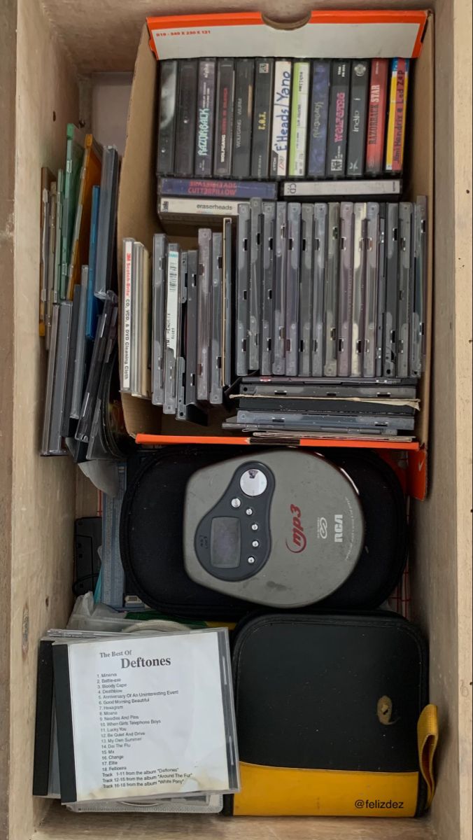 an open cardboard box filled with various video games