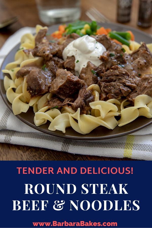 a plate of beef and noodles on a wooden table with the words tender and delicious round steak beef and noodles