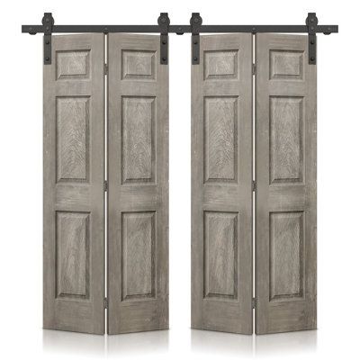 two wooden doors with black hardware on each side