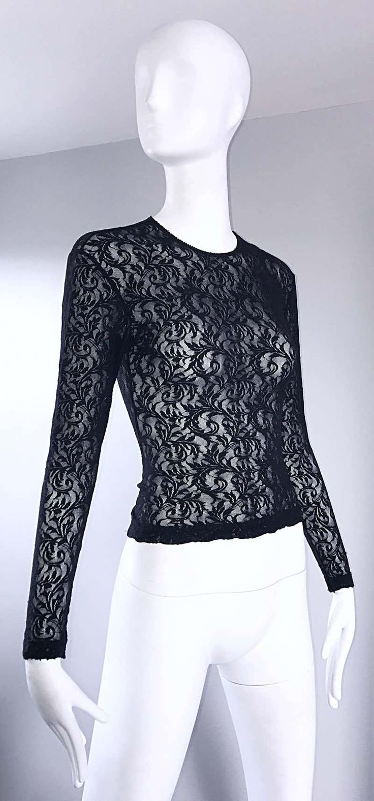 For Sale on 1stDibs - Sexy vintage 90s CALVIN KLEIN black lace cropped top shirt ! Features a fine soft lace that stretches to fit. Tailored body, with sleek long sleeves. Looks Black Lace Top With Crew Neck, Fitted Lace Top With Crew Neck, Fitted Lace Sleeve Crew Neck Top, Fitted Lace Top With Crew Neck And Lace Sleeves, Fitted Lace Top With Lace Sleeves And Crew Neck, Fitted Crew Neck Lace Top, Black Lace Tops For Party, Black Lace Party Tops, Fitted Delicate Lace Top For Night Out