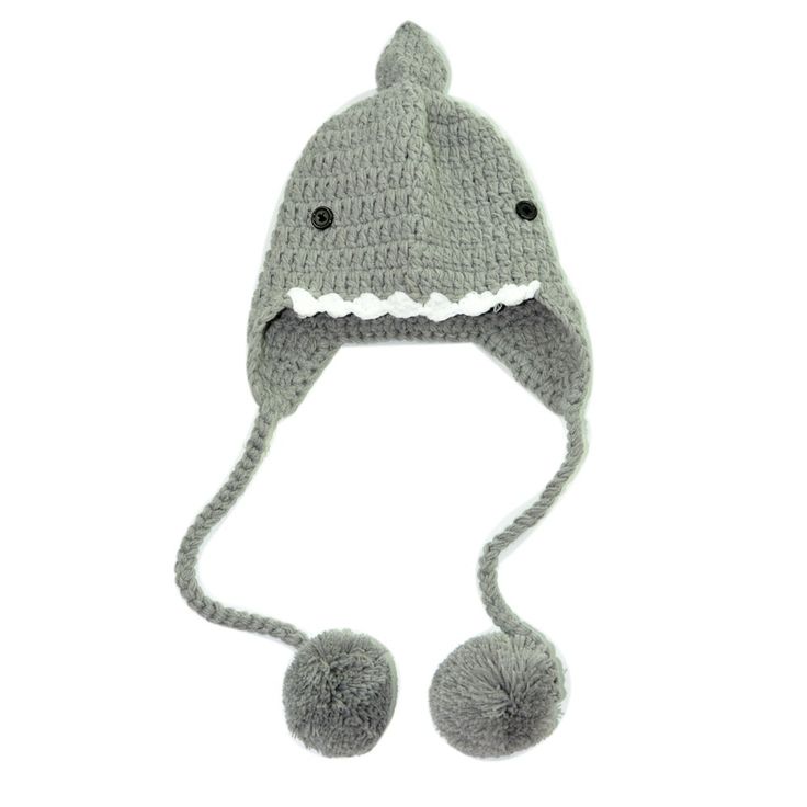 a crocheted hat with a shark's teeth on the front and side