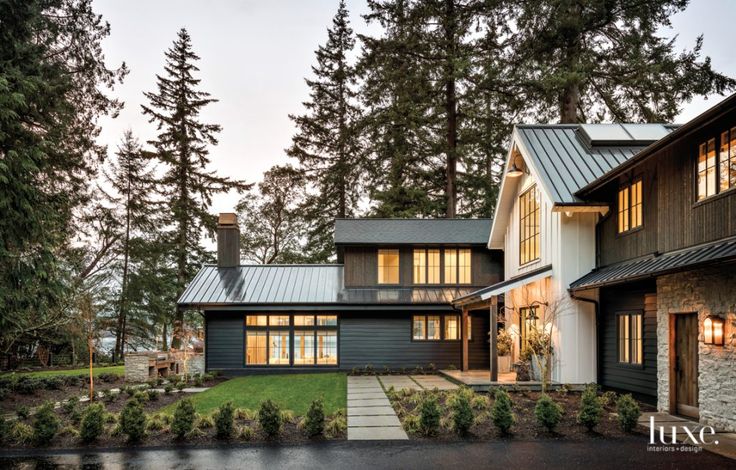 a house that is surrounded by trees and grass