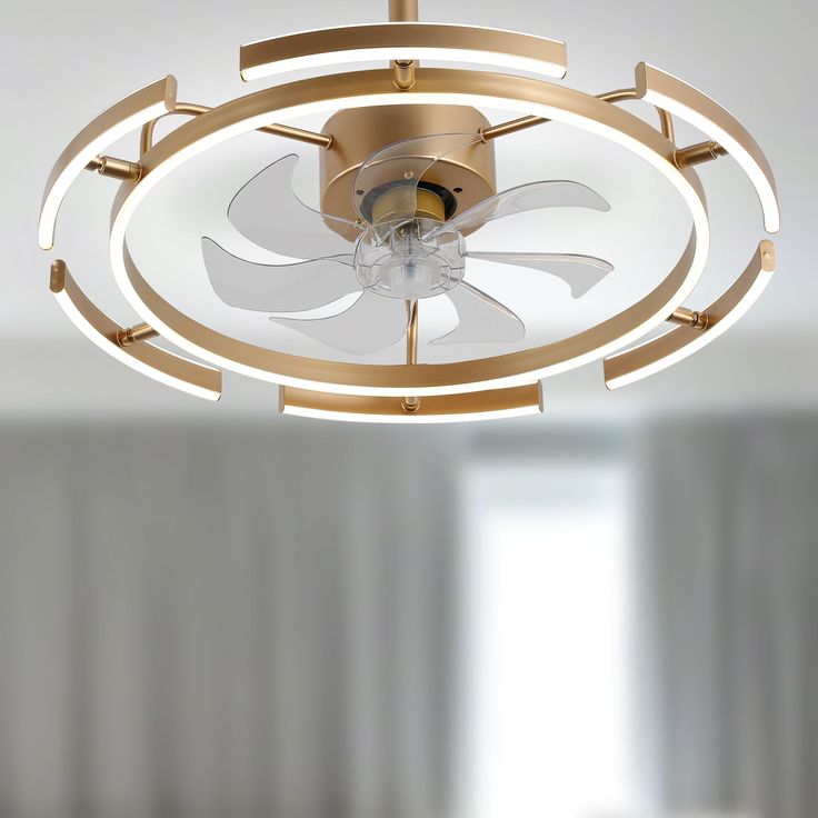 a ceiling fan that is hanging from the ceiling in a room with white walls and curtains