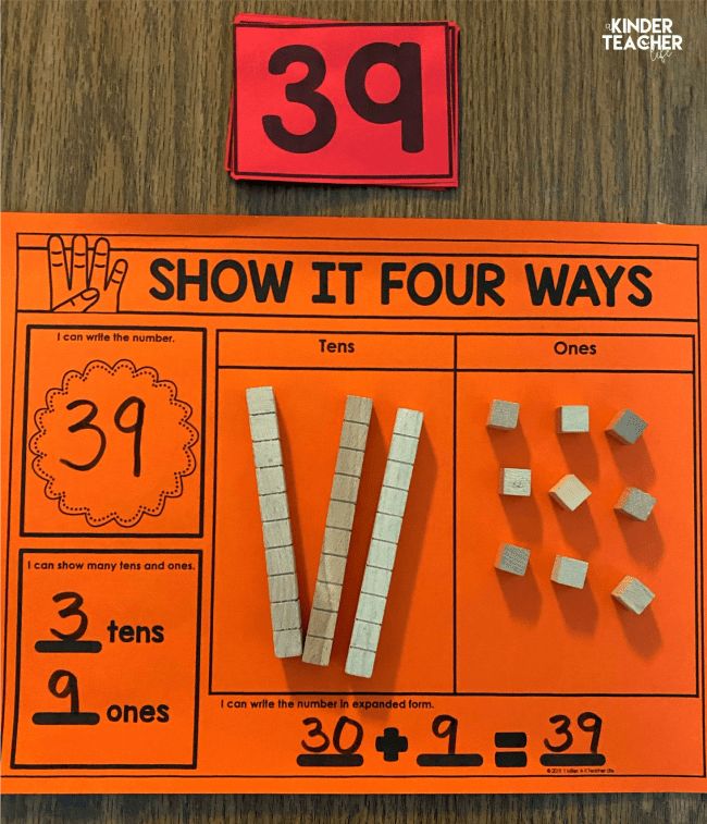 an orange sign that says 39 show it four ways and some white blocks are on the table