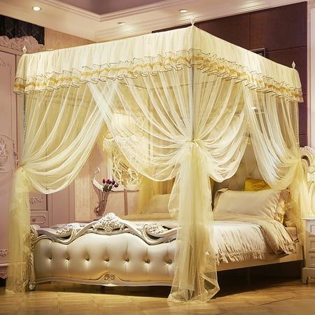 a white canopy bed with curtains and pillows on it's sides, in front of a white background