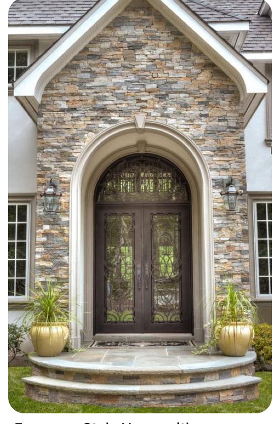 the front entrance to a house with two large pots on it's steps and an arched glass door