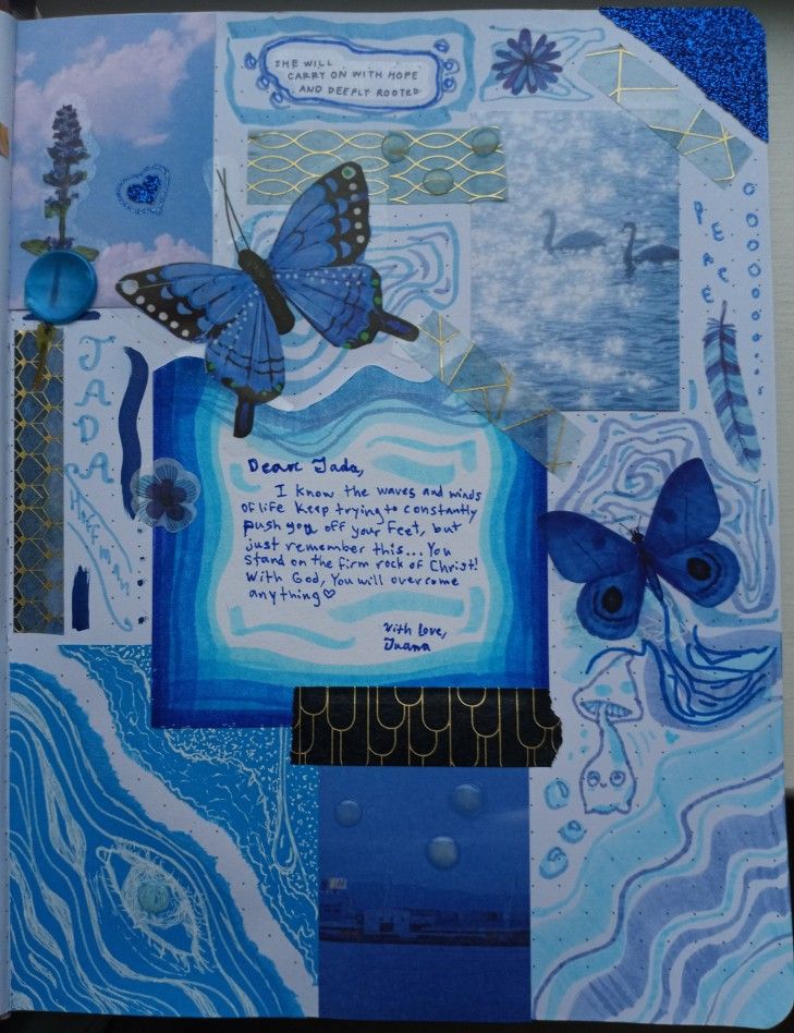 an open book with blue and white designs on the pages, butterflies flying over water