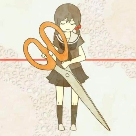 a girl is holding a pair of scissors