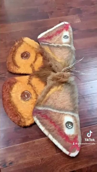 two slippers are sitting on the floor next to each other, one has been made out of wool