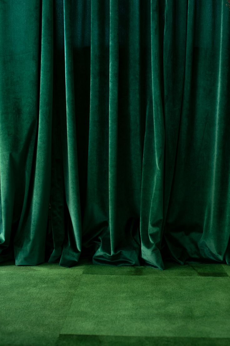 green velvet curtains are open on the floor