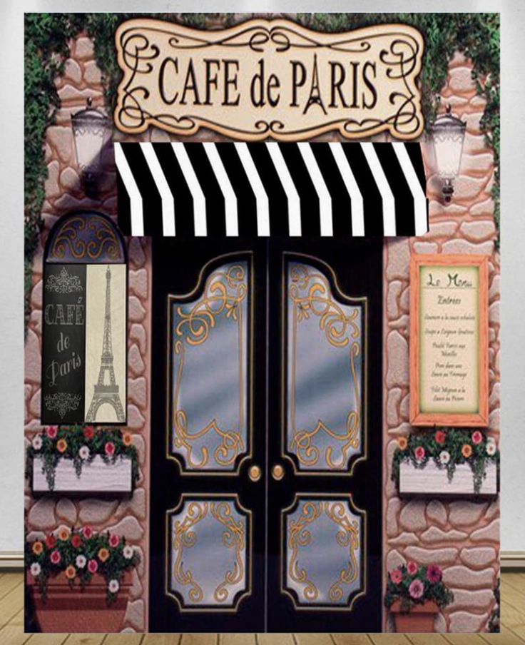 the entrance to cafe de paris is decorated with black and white striped awnings