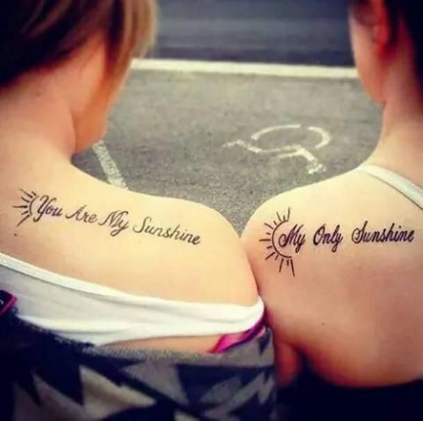 two women with tattoos that say you are my sunshine