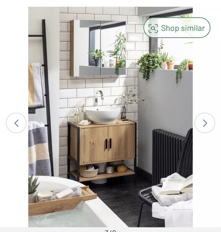 a bathroom with a sink, mirror and towel rack