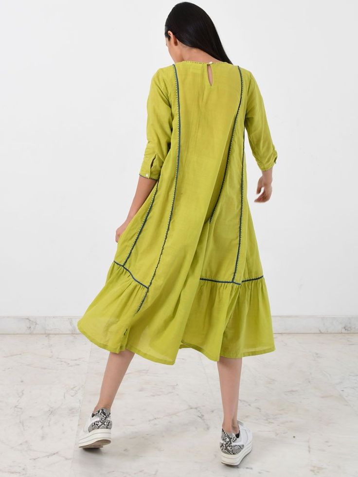 VALUES Handcrafted Organic Traditional CURATOR'S NOTE The Paneled Dress is a vibrant green midi length dress with elbow length sleeves. The piece has contrast piping and is finished off with hand stitch detailing. THE DESIGNER STORY A young clothing brand based in Jaipur, Rias is more than just a label. Focusing on two ancient crafts of India, DABU AND BLOCK PRINTING, it is a cocktail of ancient printing techniques of Rajasthan. An attempt to keep these crafts alive, Rias is a bridge between the Casual Green Midi Dress With Half Sleeves, Casual Green Half Sleeve Midi Dress, Casual Green Short Sleeve Midi Dress, Green 3/4 Length Dress For Spring, Green A-line Cotton Midi Dress, Fitted Green Dress With 3/4 Length, Fitted Summer Dress With Contrast Stitching, Green 3/4 Sleeve Summer Midi Dress, Green 3/4 Sleeve Midi Dress For Summer