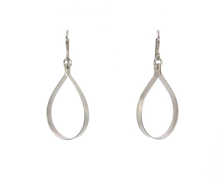 "These open teardrop hoop earrings are made from pure grade 1 titanium.  They are 1/8\" strips cut from titanium sheet then shaped and tumbled for a smooth satin finish. These earrings are completely nickel free and hypoallergenic, making them comfortable for anyone to wear. * Pure titanium  * Niobium ear wire option (drop down menu) * Earring drop length 1 1/2\", width 11/16\" * Lightweight * Nickel free  Pure titanium is considered the most hypoallergenic of all metals. It is commonly used in