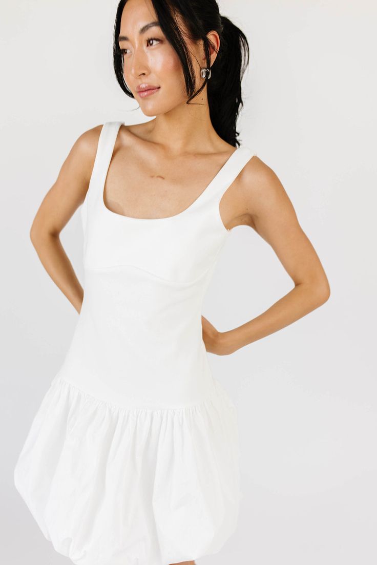 a little white dress in the hottest silhouette of the season. this drop waist white mini dress features a chic square neckline + a trendy longline body with a short bubble skirt. whether you dress it up with heels, or down with cowboy boots, you’ll be serving some serious ‘ballet core’ baddie vibes. off white // scoop neckline, drop waistband, bubble skirt model is 5'8" + wearing a small measurements are approximate + taken while laying flat small : bust 32” length 33” medium : bust 34” length 3 Baddie Vibes, Little White Dress, Ballet Core, Skirt Model, Bubble Skirt, Little White Dresses, Drop Waist, White Mini Dress, Small Bust