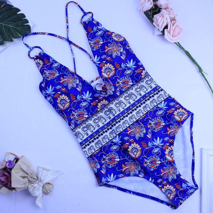 Straw hats and sandy knees are just right in the Coastal One Piece Swimsuit. Bohemian style mixed floral print swimwear offers the perfect amount of coverage. Swim or lounge because you can enjoy it in and out of the water. Congratulations, you are one of the first to try our new swim collection! Details: Bohemian style Coastal One Piece Swimsuit Bust is padded and wire free This style runs small, we recommend sizing up one full size from your typical size Let us know how we did so we can contin Casual Fitted Swimwear For Beach, Fitted Casual Swimwear For Beach, Bohemian Fitted Swimwear For Beach Party, Fitted Bohemian Swimwear For Beach Party, Summer Swimwear For Vacation, Summer Floral Print Swimwear For Pool, Floral Print Swimwear For Pool In Summer, Summer Tropical Print Swimwear For Sunbathing, Bohemian Fitted Swimwear For Summer