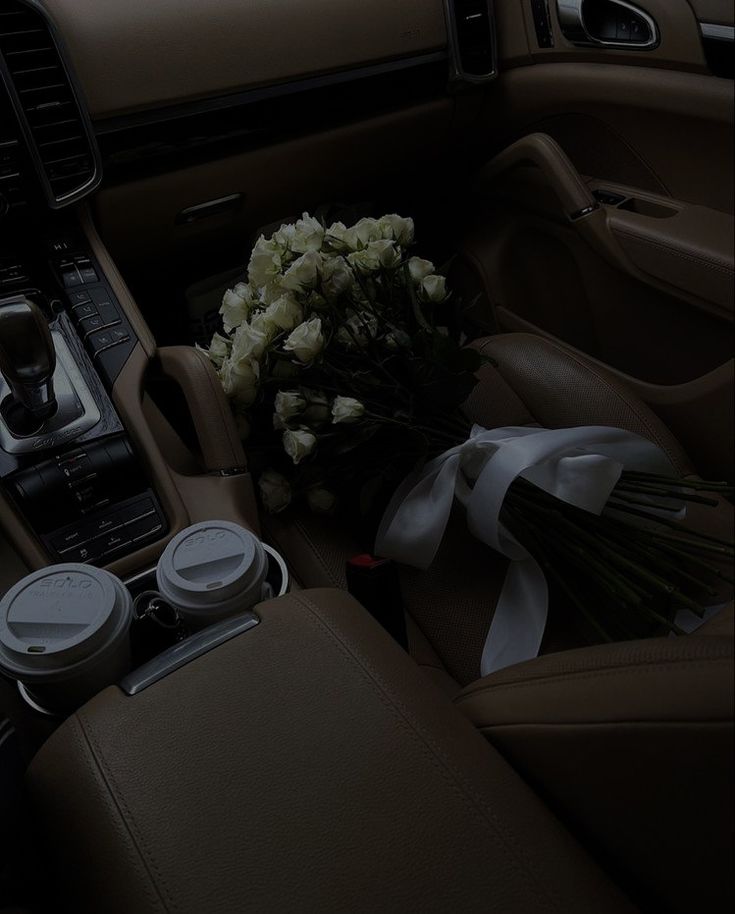 flowers in the center console of a car