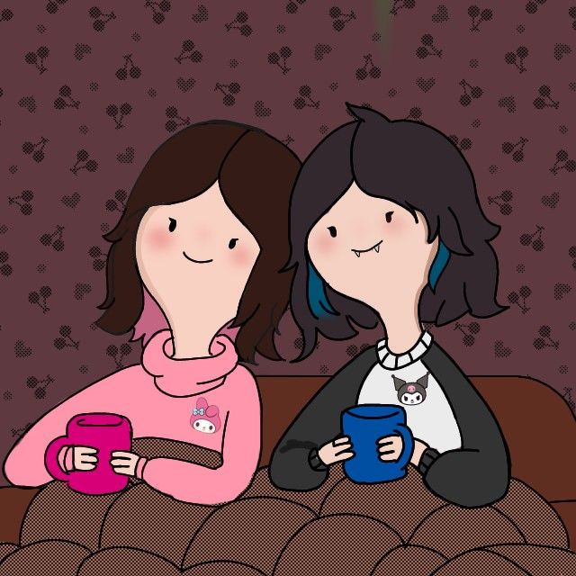 two women are sitting on a couch drinking coffee and looking at each other's eyes