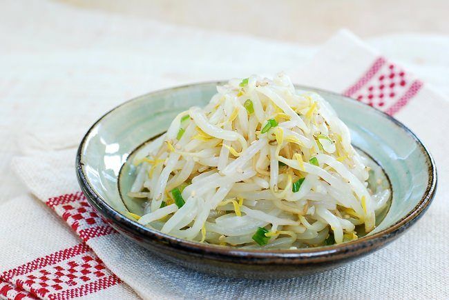 a bowl filled with coleslaw on top of a table