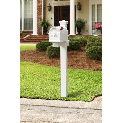 a white mailbox in front of a house