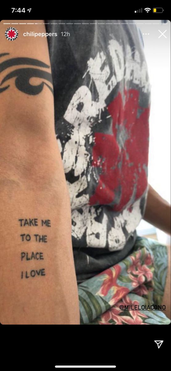 someone with a tattoo on their arm that says take me to the place i love