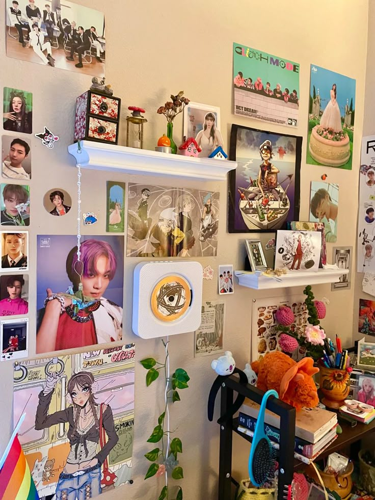 a room with many pictures on the wall and various objects hanging from the walls above it