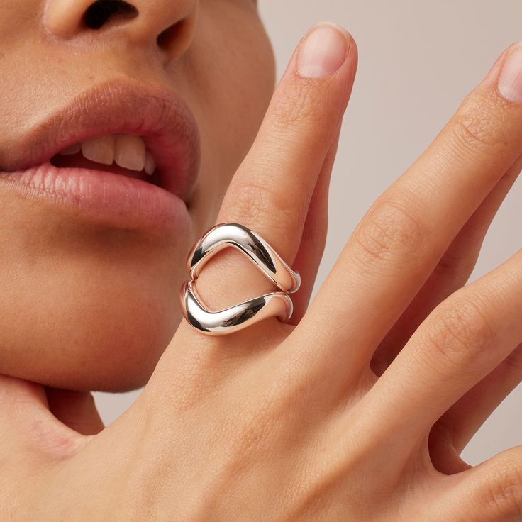 A dynamic, tubular ring set that will command center stage on your hand. Wear it three ways: As a single ring, with both rings stacked closely, or flipped in different directions. Finished in high-polish silver. silver dipped brassfinish: high polish product measurements:length (stacked together): 11mm / 0.43"height (above finger): 3.5mm / 0.14" weight (set): 15.9g / 0.56oz imported JB464-HPS Adjustable Stackable Polished Open Rings, Modernist Open Ring For Everyday, Silver Open Ring Hand-set Jewelry, Adjustable Open Ring In Modernist Style, Modernist Open Ring With Polished Finish, 14k Gold Ear Cuff, Rings Stacked, Jenny Bird, Weight Set