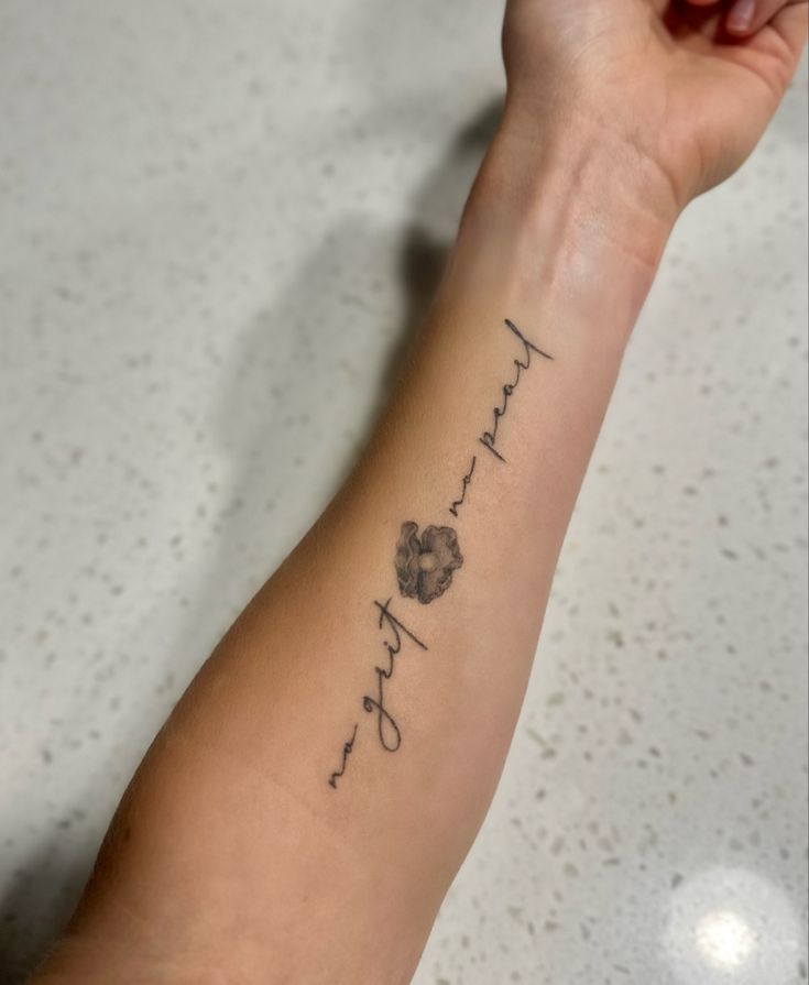 a woman's arm with a tattoo that reads, thank you