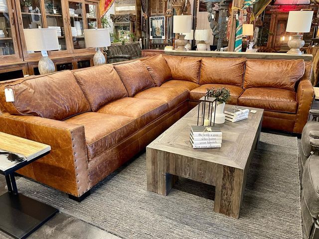 a living room filled with lots of furniture in it's centerpieces on display