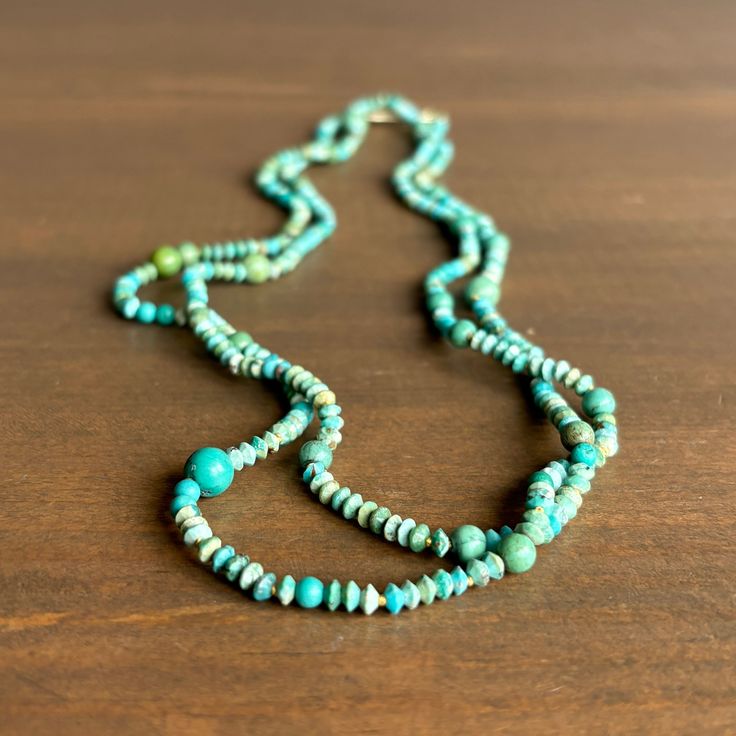 Itty bitty turquoise stones trickle along silk in this refreshing long strand. 14k green gold, silk Turquoise beads are 3-6mm wideNecklace is 37" Green Multi-strand Hand-strung Necklaces, Green Single Strand Beaded Necklace In Amazonite, Green Amazonite Single Strand Beaded Necklace, Single Strand Turquoise Chrysocolla Necklace, Turquoise Multi-strand Necklace With Gemstone Beads, Turquoise Single Strand Amazonite Beaded Necklace, Green Turquoise Double Strand Bohemian Necklace, Green Double Strand Bohemian Turquoise Necklace, Turquoise Single Strand Amazonite Necklace