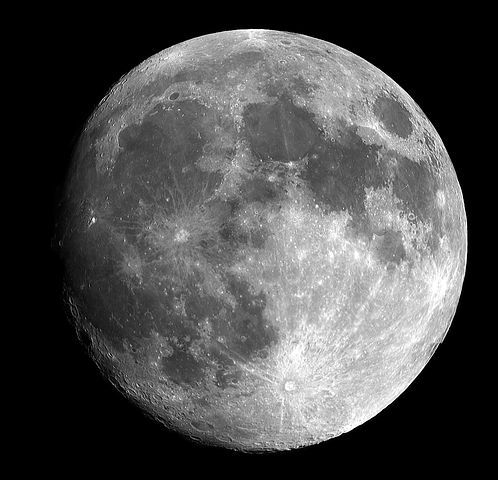 the full moon is shown in black and white