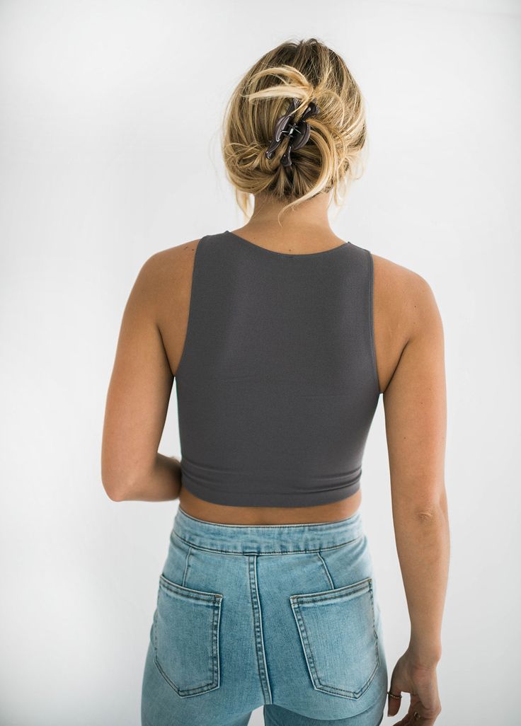 So comfy and stretchy, yet incredibly chic! You will want to live in our run away crop top. The crop length is perfect. If you want it a bit longer size up one. It is perfect with your fav pair of denim, joggers or shorts! Layer it or wear it on its own. You can wear it with anything. We can't wait to see how you style yours. Size Chart Features: crew neck neckline seamless ribbed sleeveless fabric content: 92% nylon : 8% spandex model is wearing a small/medium. Height 5'8", Bust 32", Waist 25", Gray High Stretch Tops With Built-in Bra, Casual Cropped Sports Bra With Built-in Bra, High Stretch Crop Top With Built-in Bra, Casual Seamless Crop Top For Everyday, Casual Gray Crop Top With Built-in Bra, Casual Crop Top With Built-in Bra For Everyday, Seamless Stretch Crop Top For Everyday, Everyday Stretch Seamless Crop Top, Bra-friendly Everyday Crop Top