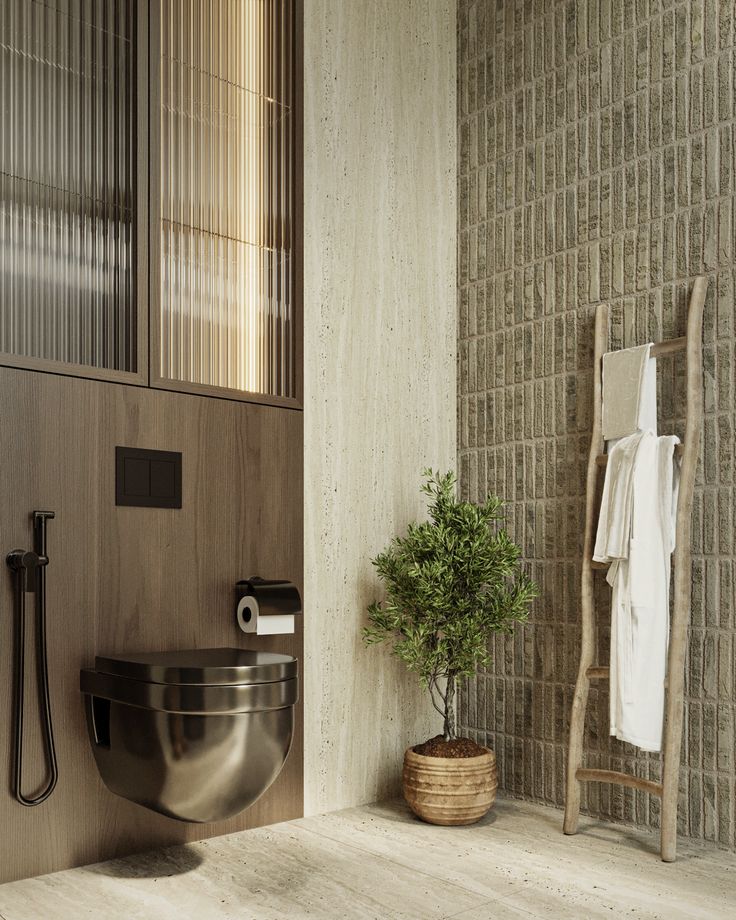 a bathroom with a toilet, sink and towel rack on the wall next to it