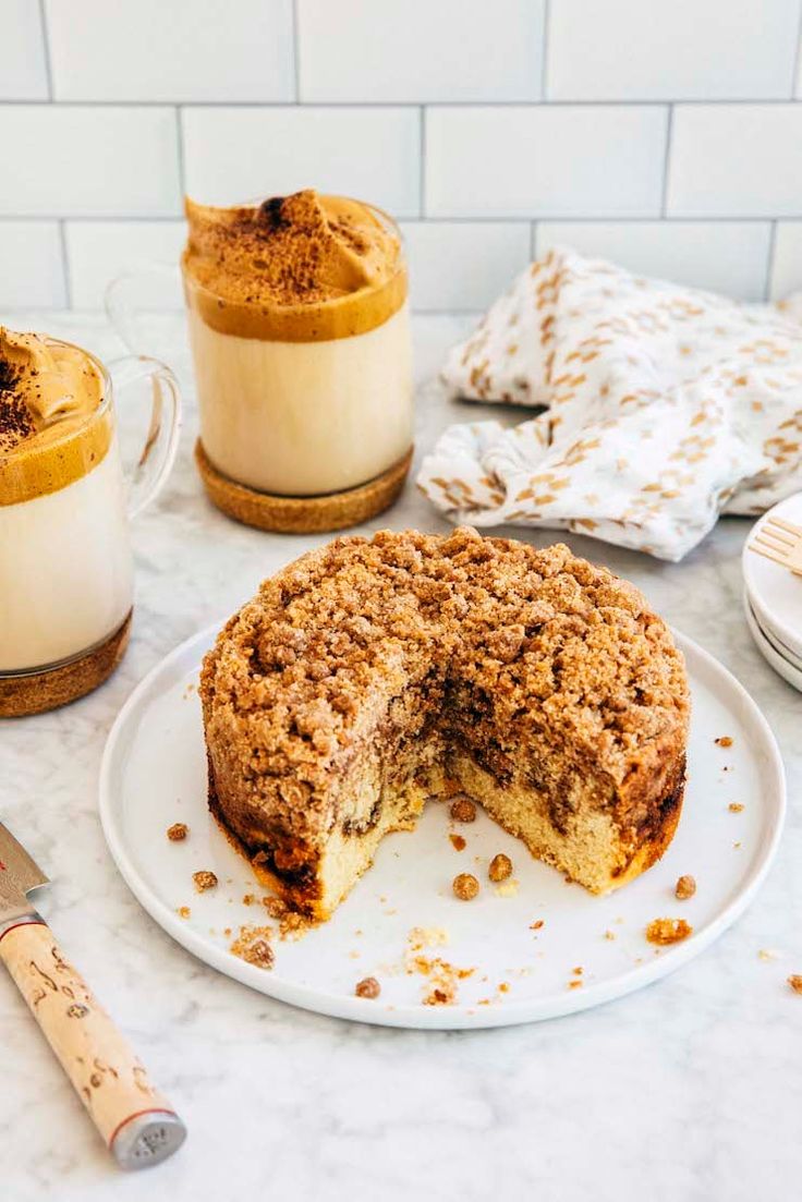 a cake on a plate with one slice cut out and the other half is missing