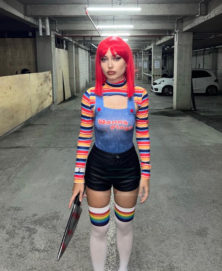 a woman with red hair is dressed in an underground parking garage