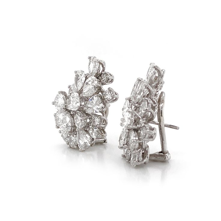 Elegant diamond platinum earrings with a cluster of brilliant pear cut diamonds 10.98 carat total. Diamonds are white and natural and in G-H Color Clarity VS. Platinum 950 metal. French Omega clips. Contemporary elegant style at it's best. Length: 2.5 cm Width. 1.7 cm Weight: 16.12 g [shortcode] [video] [/video] [/shortcode] Diamond Cluster Earrings Studs, Classic Diamond Cluster Earrings, Cluster Diamond Earrings, Diamond Earing Designs Unique, Antique Diamond Earrings, Classic Diamond Earrings, Cluster Jewelry, Real Diamond Earrings, Diamond Tops