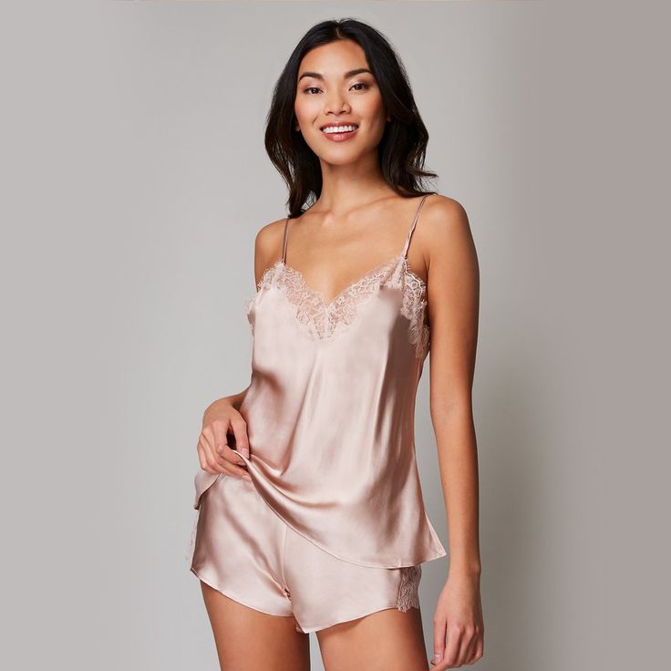 This Charlotte Camisole Tank Top from Journelle offers a beautiful staple in your closet, making it easy to create a stunning look for lounging at home or a chic ensemble for going out. Featuring soft and lightweight 100% silk fabric construction with scalloped eyelash edging along the V-neckline, this lace-detail camisole combines a luxuriously comfortable feel with stylish details for an option you will reach for again and again. The silk ribbon spaghetti straps adjust in the back to help you Pajama Tank Top, Tap Shorts, Tap Pants, High Neck Tank Top, Tank Top Camisole, Pink Tank Top, Womens Loungewear, Bottom Clothes, Lace Shorts