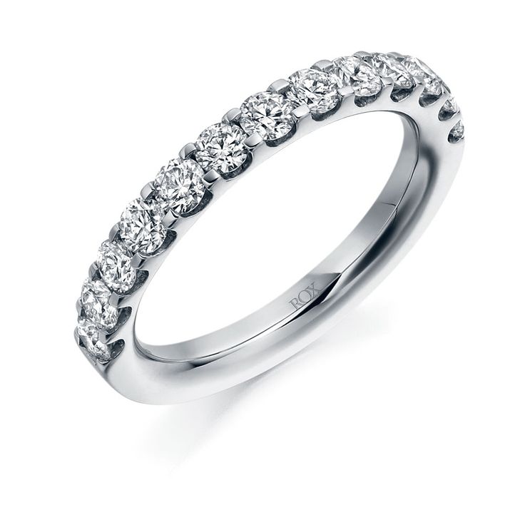 a white gold wedding ring with five stones on the side and four rows of diamonds